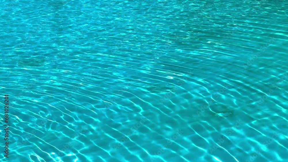 Water Caustics Background on a sunny day - clear pool water - travel photography Water Caustics Background on a sunny day - clear pool water - travel photography