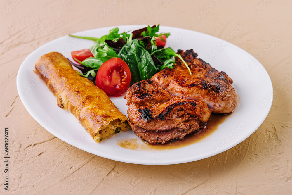 Tasty grilled beef steak with salad