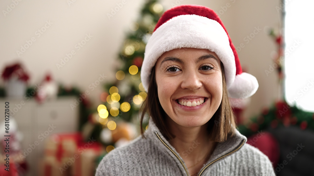 Young beautiful hispanic woman smiling confident standing by christmas tree at home Young beautiful hispanic woman smiling confident standing by christmas tree at home