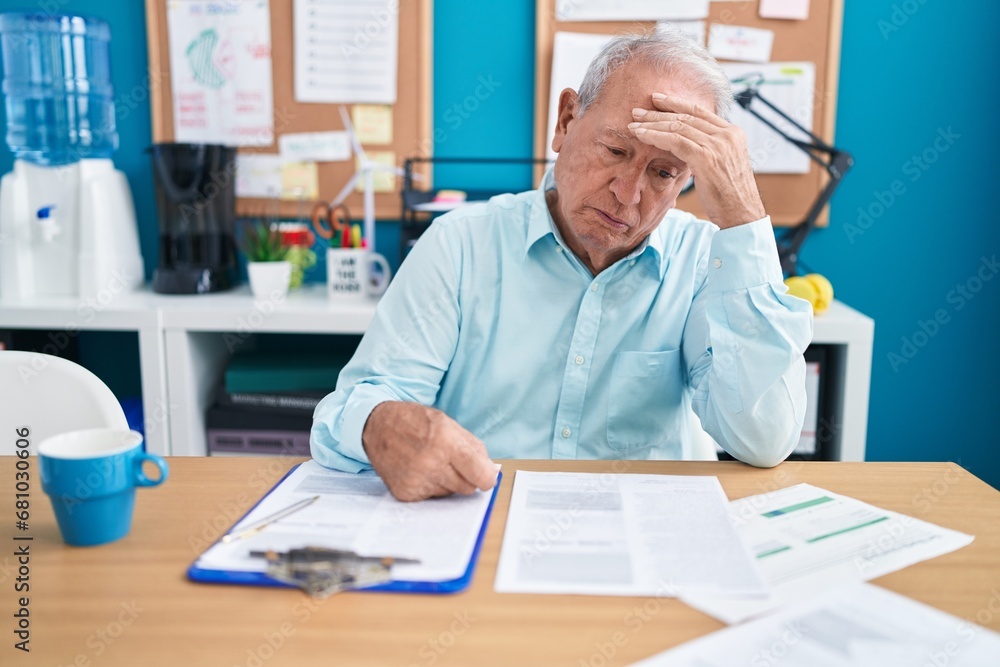 Middle age grey-haired man business worker stressed working at office Middle age grey-haired man business worker stressed working at office