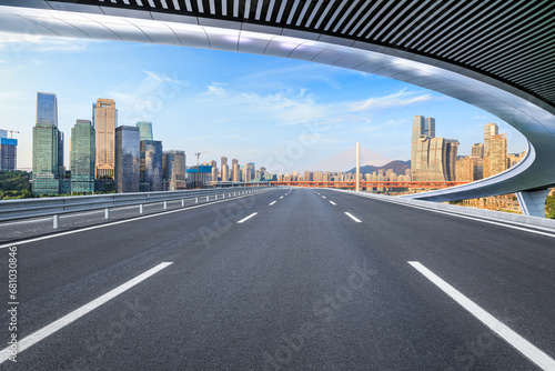  Asphalt highway road and urban skyline with modern buildings scenery in Chongqing, China.