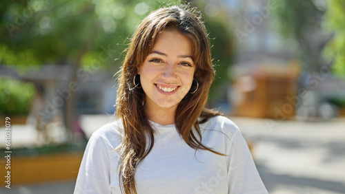 Young beautiful hispanic woman smiling confident standing at park
