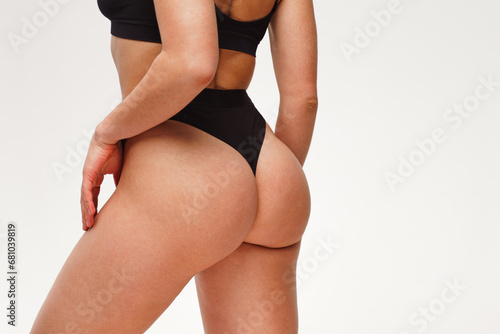 Billede på lærred A woman with a beautiful feminine figure in black lingerie with overweight, cellulite and stretch marks