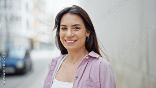 Young beautiful hispanic woman smiling confident standing at street Free Download Young beautiful hispanic woman smiling confident standing at street - GFXLoad