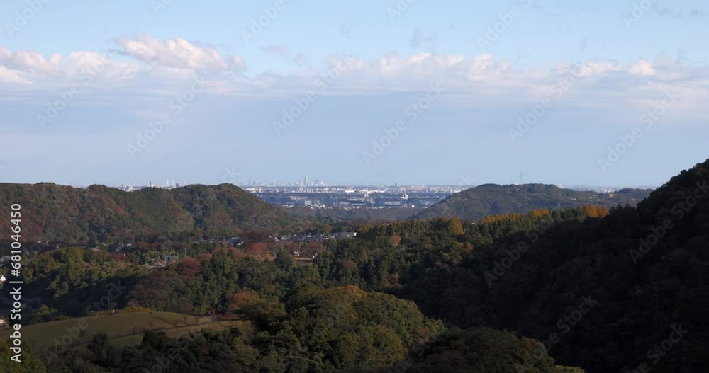 A view of the city in the distance from the mountains. A view of the city in the distance from the mountains.