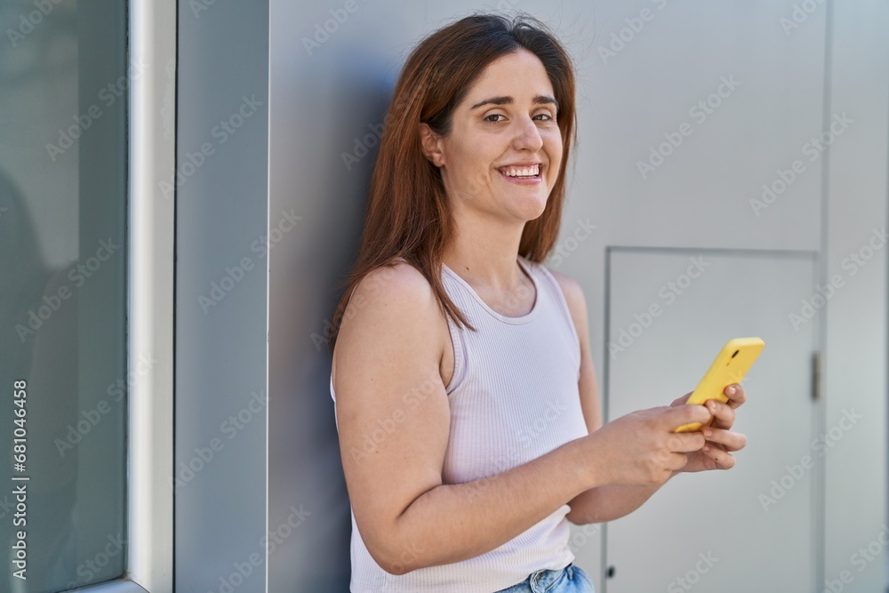 Young woman smiling confident using smartphone at street Young woman smiling confident using smartphone at street