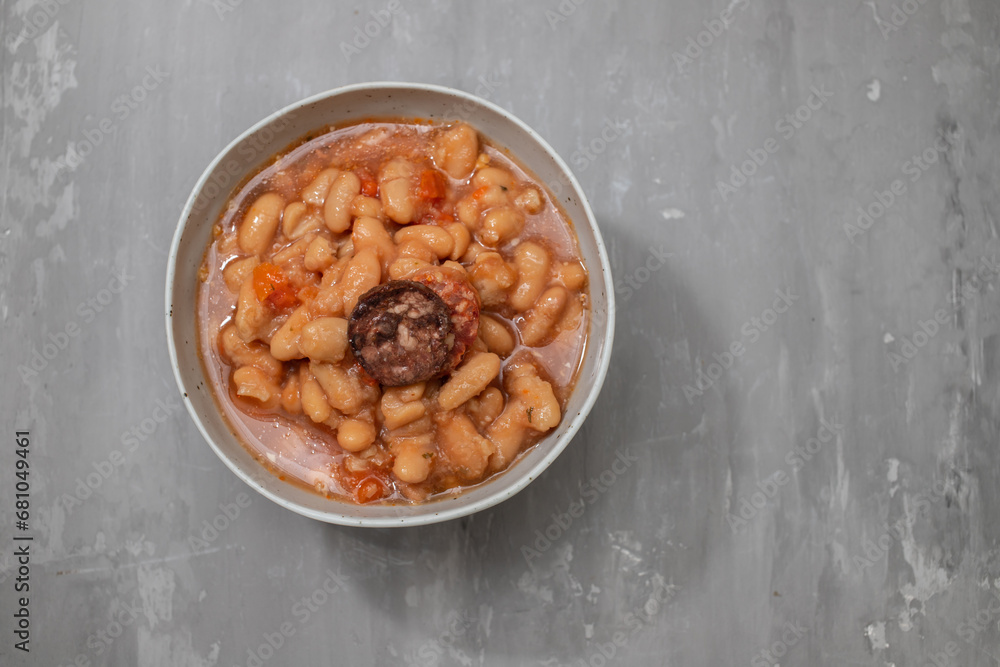 Fototapeta premium typical portuguese dish dobrada with beans in white dish