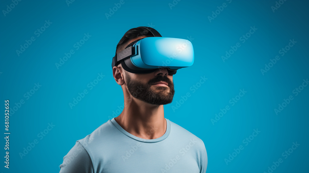 Man with VR Headset infront of a Blue Background. Man in Casual Attire Exploring Virtual Worlds with a VR Headset Man with VR Headset infront of a Blue Background. Man in Casual Attire Exploring Virtual Worlds with a VR Headset