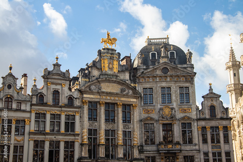 La Grand-Place in Brussels dating from the late 17th century. The buildings surrounding the square include opulent Baroque guildhalls of the former Guilds of Brussels, the city's Flamboyant Town Hall