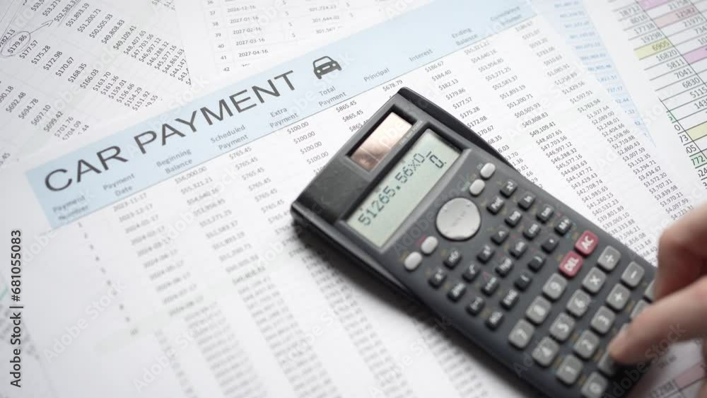 Calculating Car Payment With Calculator Over Finance Document Calculating Car Payment With Calculator Over Finance Document