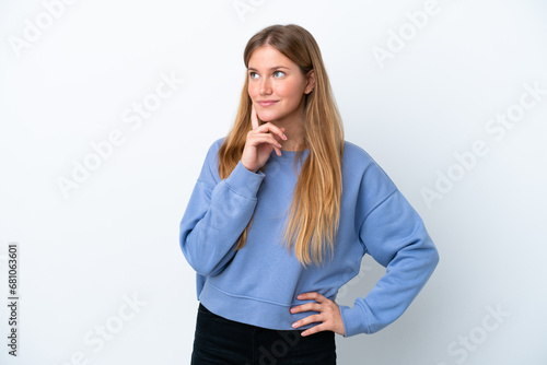Young blonde woman isolated on white background thinking an idea while looking up