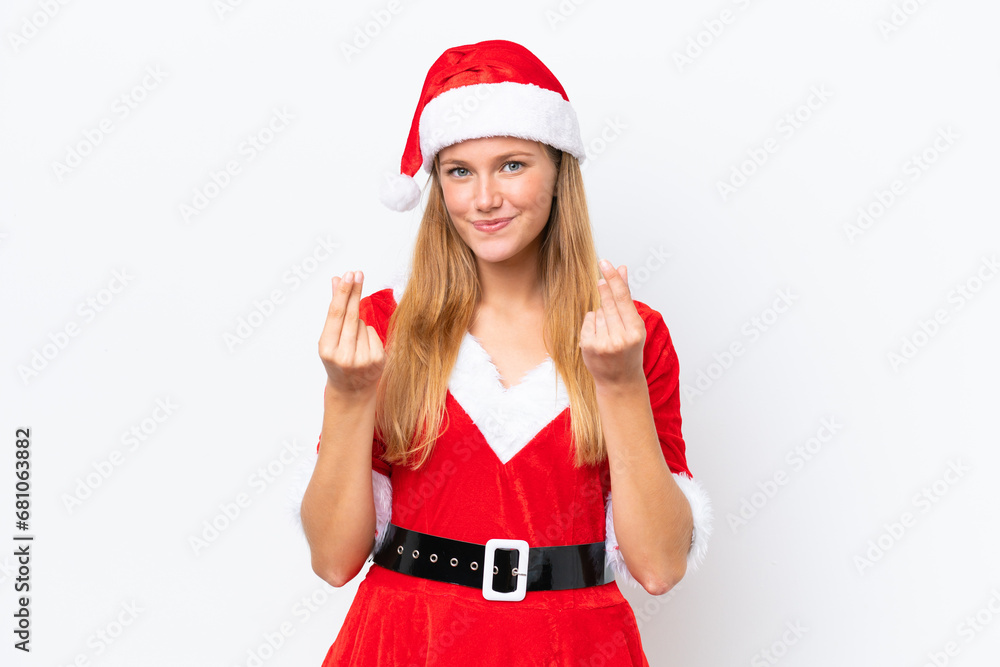 Young caucasian woman dressed as mama noel isolated on white background making money gesture Young caucasian woman dressed as mama noel isolated on white background making money gesture