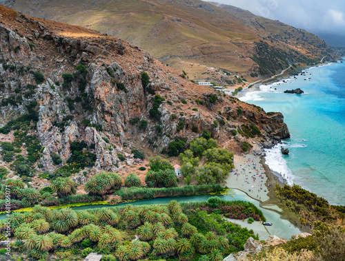 Fototapeta Naklejka Na Ścianę i Meble -  View famous beach with river and palm trees in Libyan sea. Crete, Greece