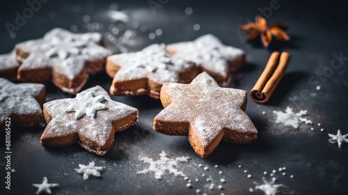 Christmas gingerbread cookies with icing sugar on dark background. Toned