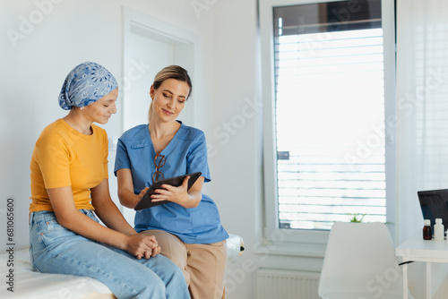 Teenage oncology patient talking with doctor. Oncologist treating teen girl with cancer and provide emotional support, helping her with anxiety and depression. photo