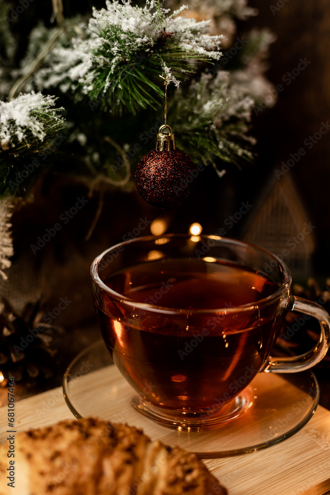 Cup of tea with croissant near Christmas tree.New Year's Eve at home with family Cup of tea with croissant near Christmas tree.New Year's Eve at home with family