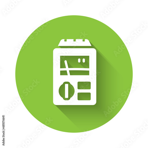 White Dosimeter for measuring radiation icon isolated with long shadow background. Gamma radiation personal dosimeter. Green circle button. Vector