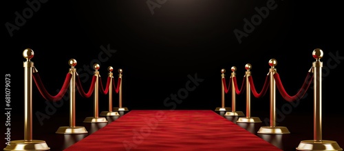 Red carpet for VIP entrance at awards or show events with gold stanchions Copy space image Place for adding text or design photo
