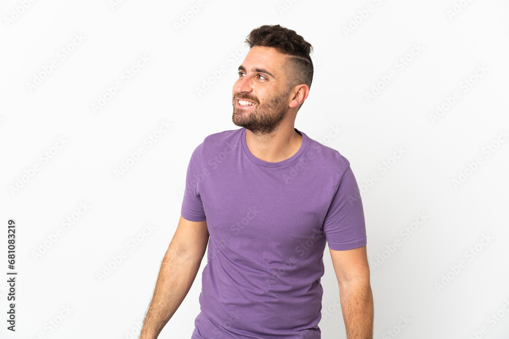 Caucasian man isolated on white background looking to the side and smiling Caucasian man isolated on white background looking to the side and smiling