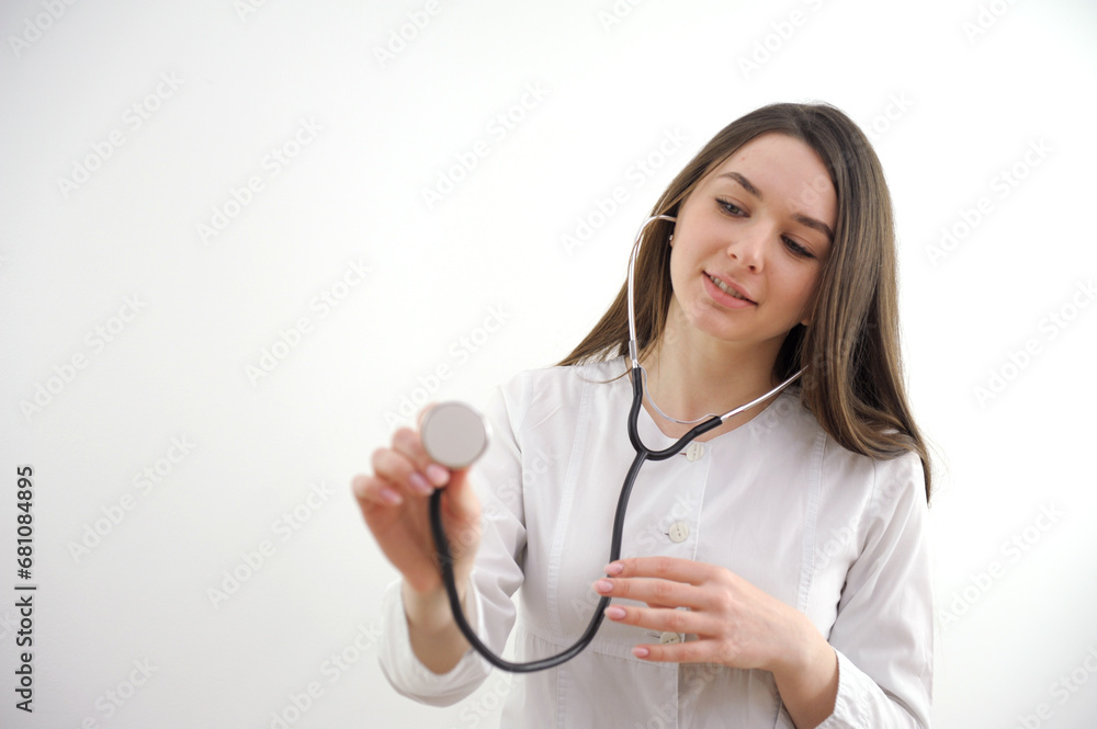 Young Doctor with stethoscope. Isolated on white background. Studio lighting. Concept for healthy. High quality photo Young Doctor with stethoscope. Isolated on white background. Studio lighting. Concept for healthy. High quality photo