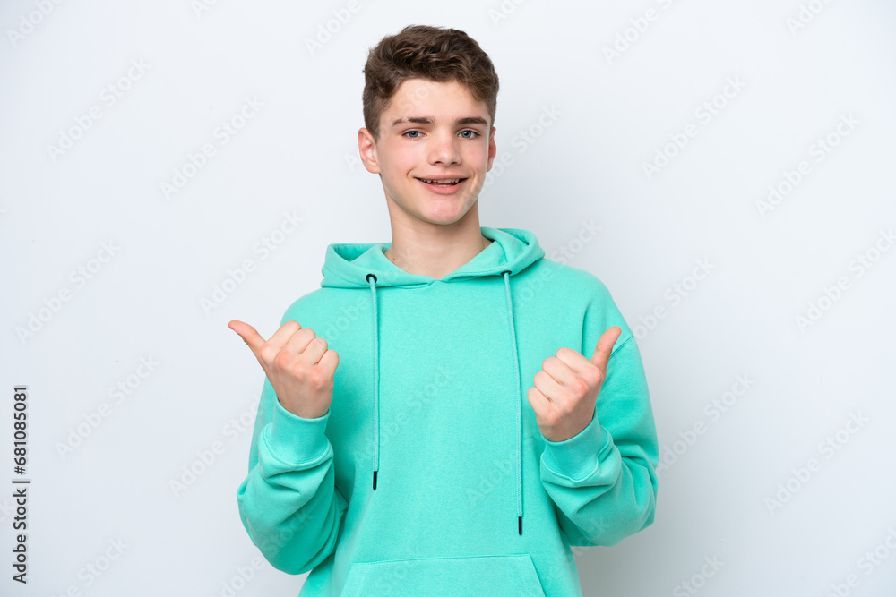 Fototapeta premium Teenager Russian man isolated on white background with thumbs up gesture and smiling