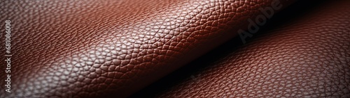 Close-up of Textured Brown Leather Surface with Intricate Grain and Fold © DigitalMuse