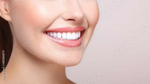 Beautiful female smile after teeth whitening procedure. Dental care. Dentistry concept. Pink background with copy space.