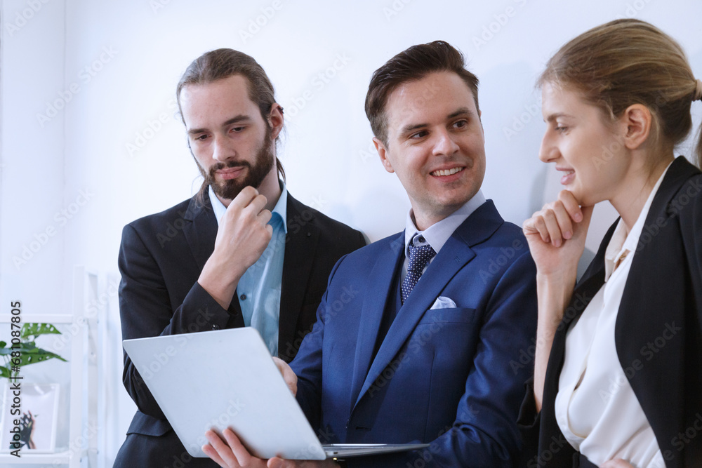 Business team working on master plan. Happy smiling businessman and businesswoman talking about success marketing plan after meeting and presenting to the manager. Business team working on master plan. Happy smiling businessman and businesswoman talking about success marketing plan after meeting and presenting to the manager.