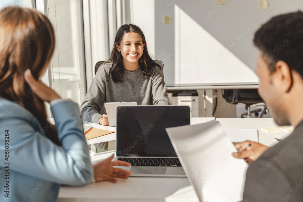 Group of confident businesspeople, smiling middle aged woman talking, brainstorming Group of confident businesspeople, smiling middle aged woman talking, brainstorming