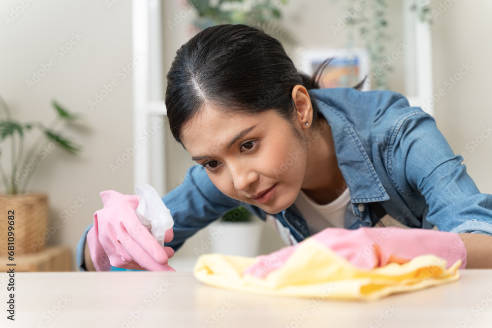 Close-up hand of maid cleaning table during household job. Close-up hand of maid cleaning table during household job.