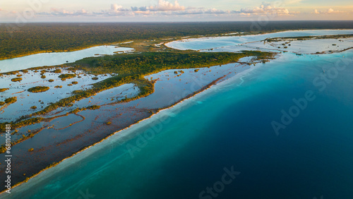 Seven colours lagoon in Bacalar Mexico resort beach town at sunset drone aerial footage