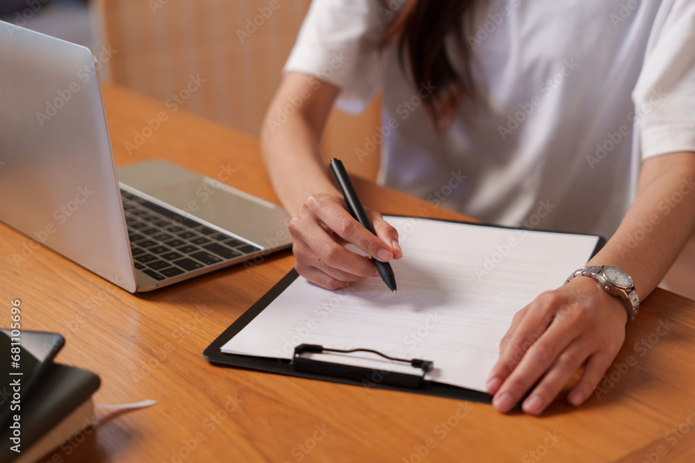 woman reading business information, working at home woman reading business information, working at home