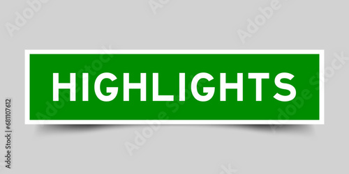 Green color square shape sticker label with word highlights on gray background
