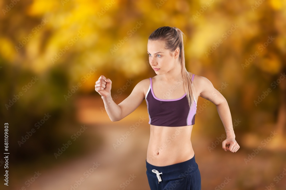 Hello autumn. happy woman running in the park Hello autumn. happy woman running in the park