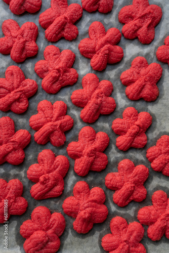 traditional Chinese New Year red sand cookie, symbolizing luck and happiness. cookies are baked during Chinese New Year celebration. captures intricate details of festive, representing good fortune