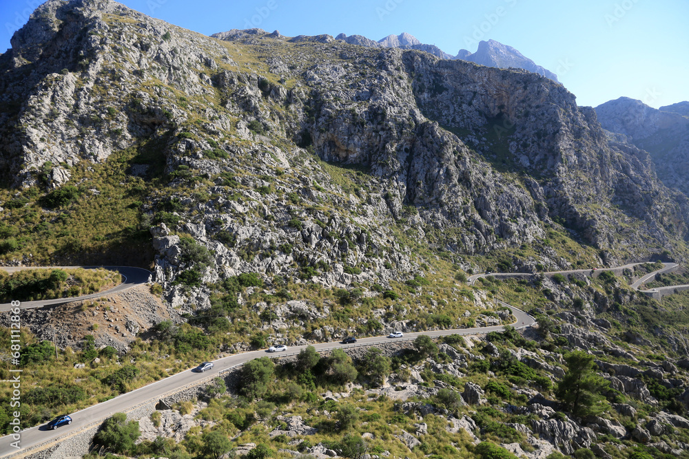 serpentine road between mountains landscape