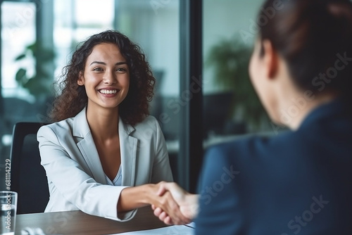 Business people shaking hands with success business at office photo