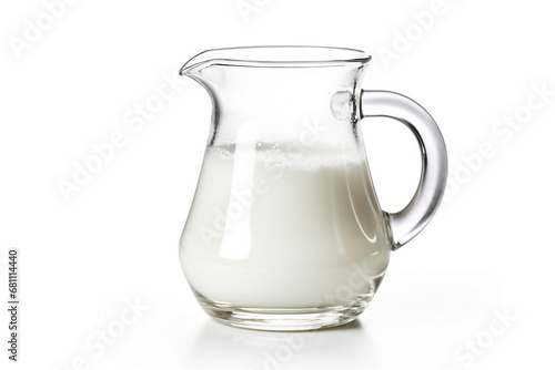 Glass jug of milk isolated on white background