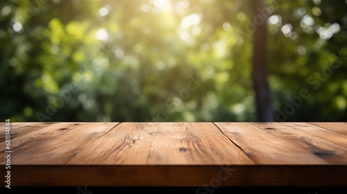 Close up top wooden table with forest in the background, sunny day.