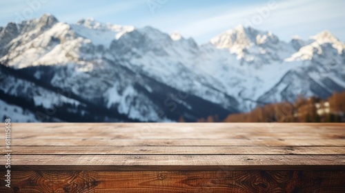 Close up wooden table with snowy mountains in the background, high quality.  © Yacine