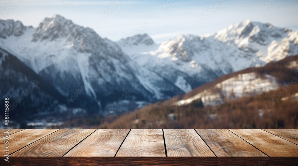 Close up wooden table with snowy mountains in the background, cloudy sky.
