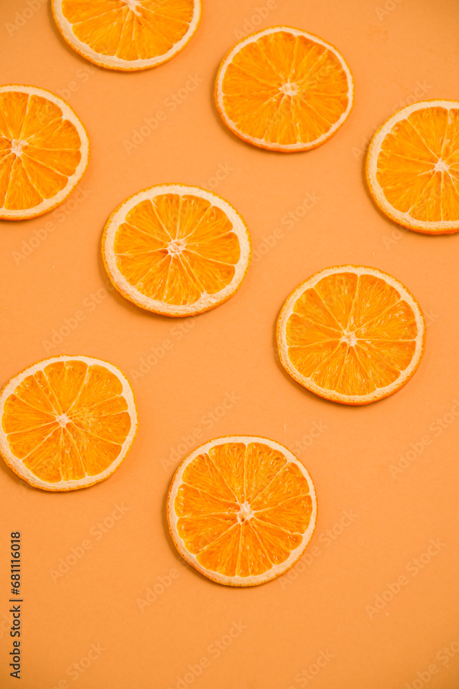 Dried orange circles on a bright light background. View from above Dried orange circles on a bright light background. View from above