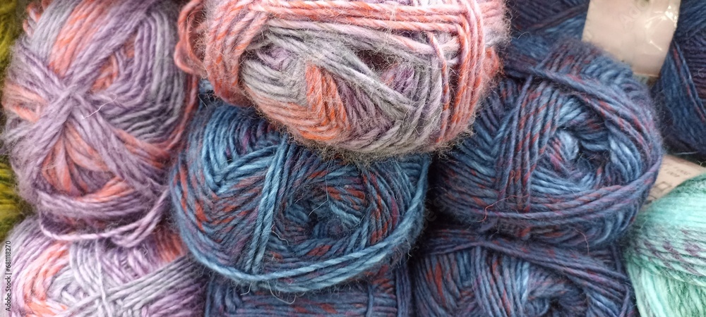 multi-colored skeins of thread folded in a stack close-up