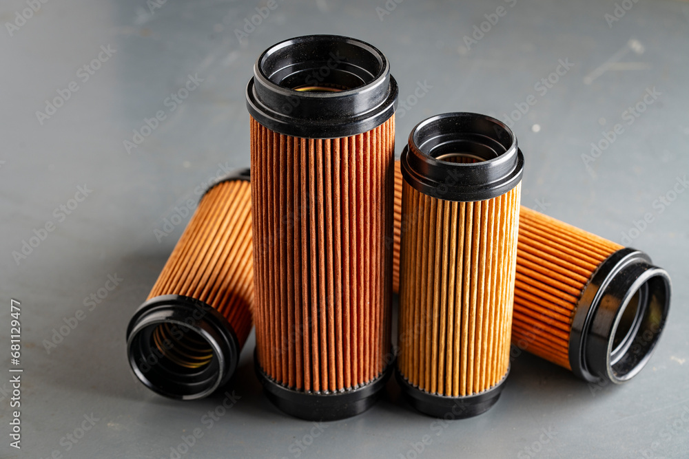 Air filters for engine car on grey background, closeup. Auto parts accessories for retro cars - obrazy, fototapety, plakaty 