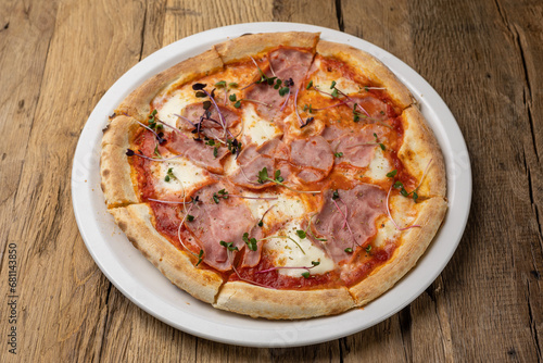 delicious pizza with ham and cheese