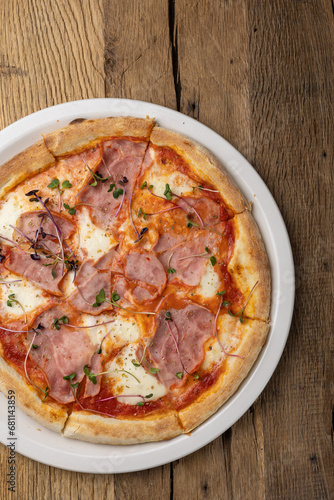 delicious pizza with ham and cheese