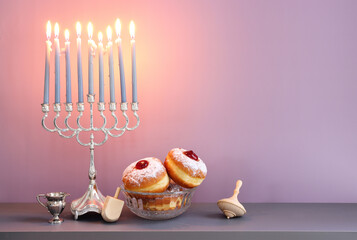 Religion image of jewish holiday Hanukkah background with menorah (traditional candelabra) and candles