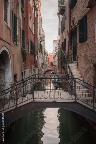 A picturesque bridge over a canal in Venice, Italy. The specific location, architectural style, and surrounding details are unspecified, leaving much to the imagination.
