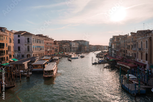 Experience the romance and serenity of Venice with this stunning image of gondolas on the Grand Canal. The rich history and unique architecture of the city are beautifully captured. © Aerial Film Studio