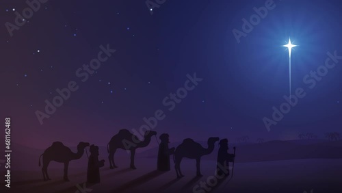 Convoy of the three wise men with their camels following the shepherd's star, at night in the desert (20 s animation loop) photo